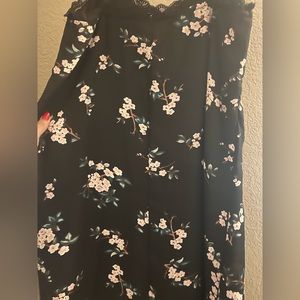 Black slip style dress with print and lace trim.